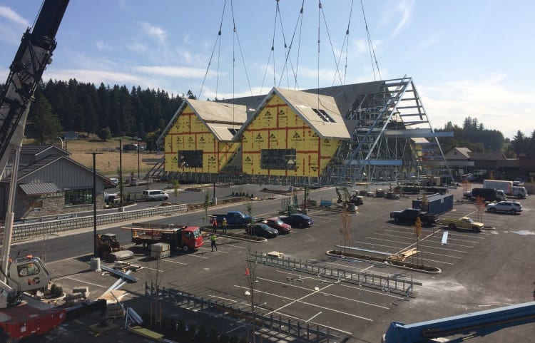 Lifting the top of an unfinished building using rigging safety