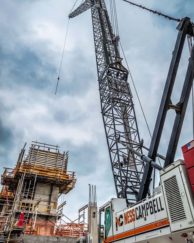 A crane hoists a heavy equipment with precision and strength | Crane Operation | NessCampbell